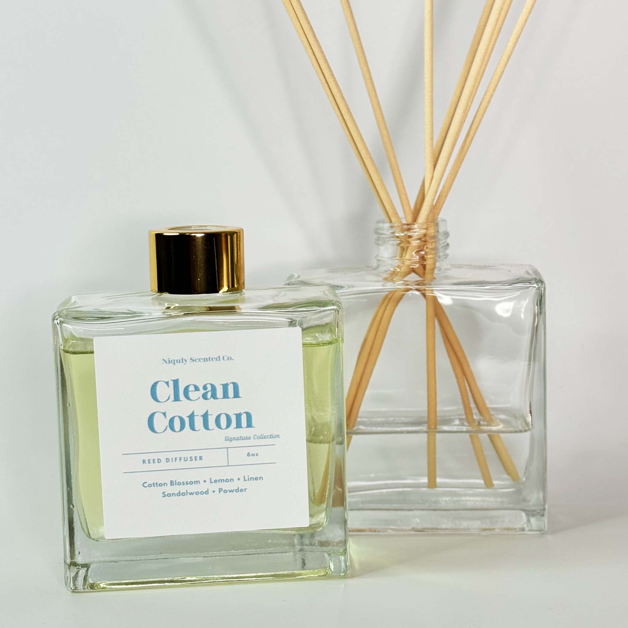 A fresh Clean Cotton reed diffuser that fills the room with the scent of crisp, freshly laundered linens.