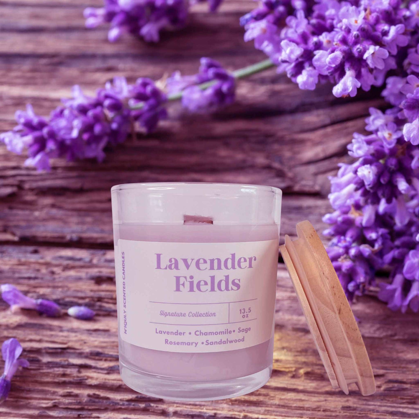 Lavender Fields scented candle in a glass jar, softly flickering