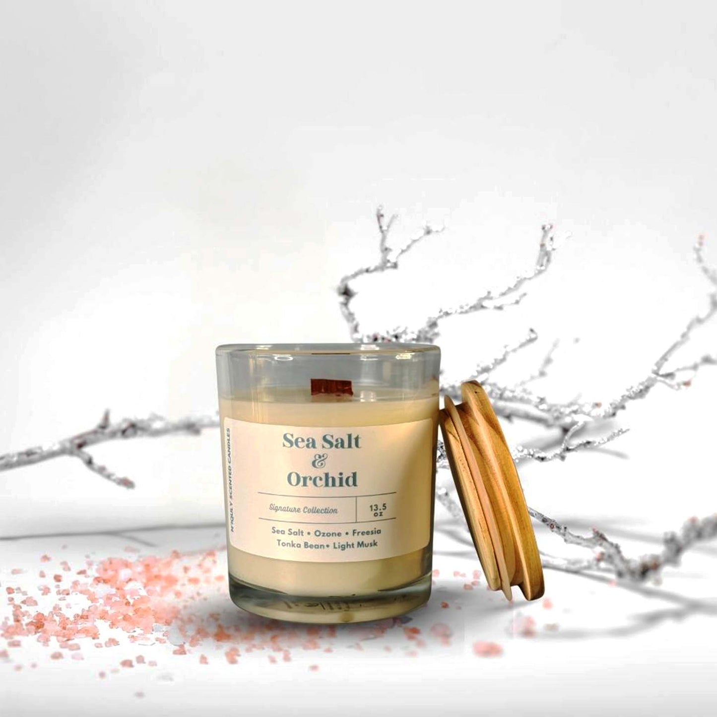 Minimalist Sea Salt & Orchid candle emitting a gentle floral scent