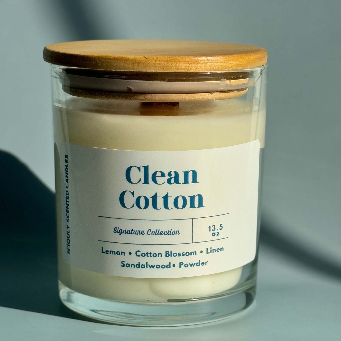 Crisp and fresh clean cotton-scented candle for a cozy feel.
