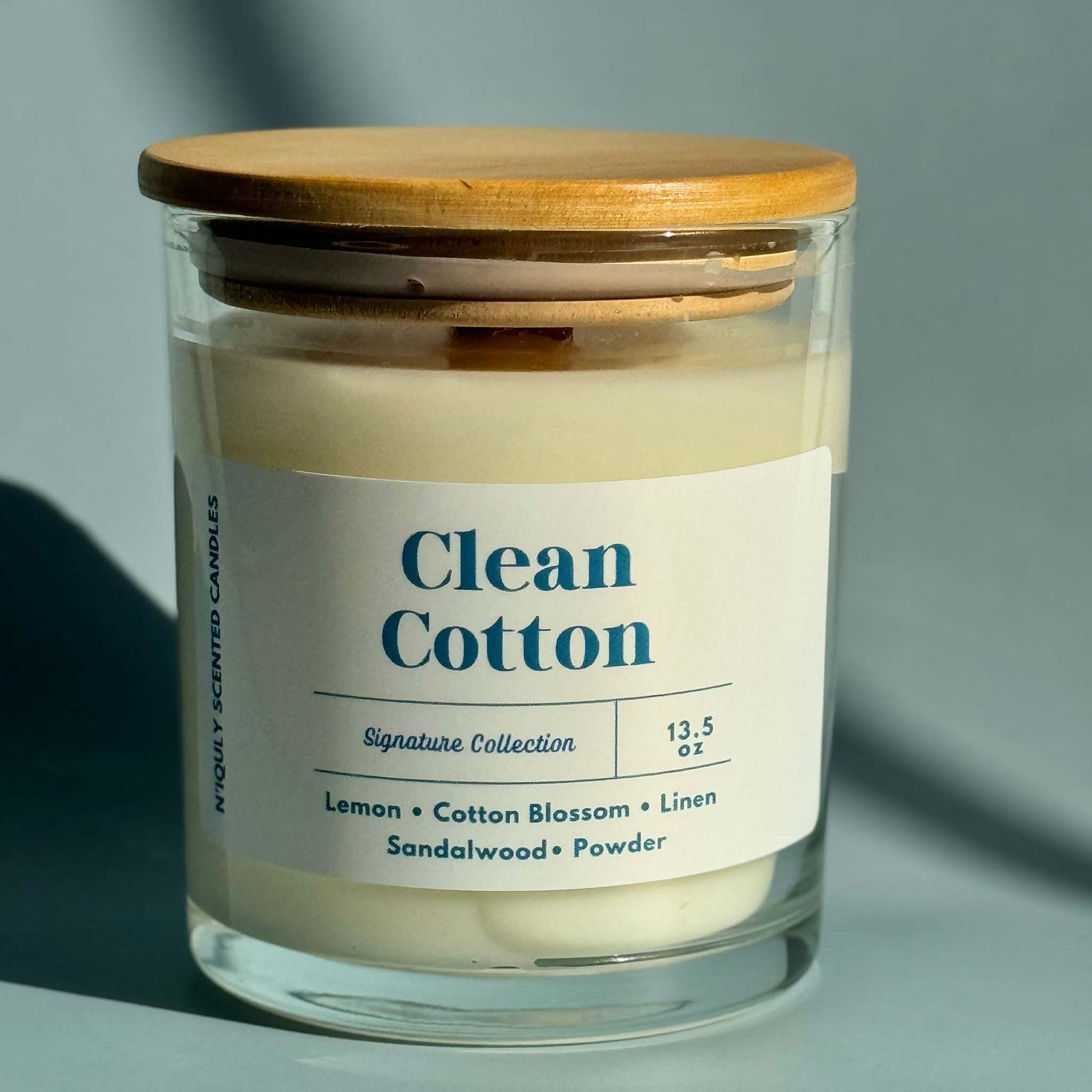 Crisp and fresh clean cotton-scented candle for a cozy feel.